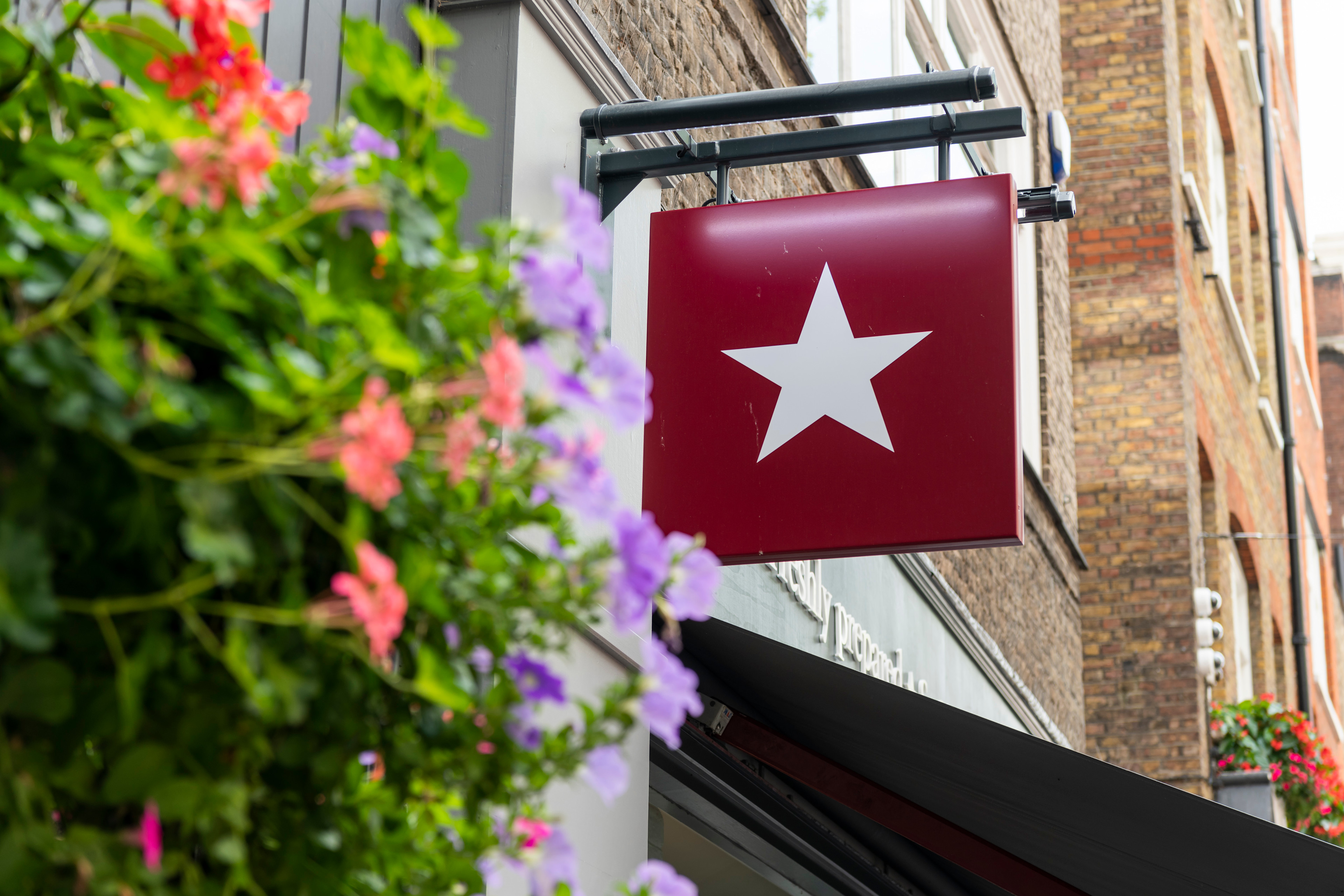 Image of a hanging Pret sign outside a pret shop