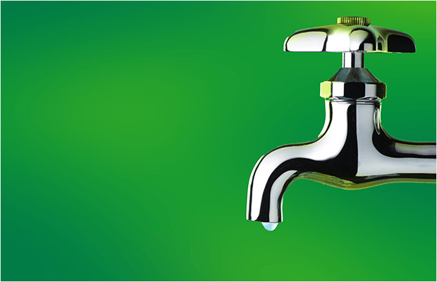 Tap With A Water Droplet And Green Background