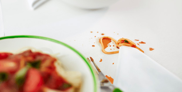 Tomato Sauce Stain From Pasta On A White Table Cloth