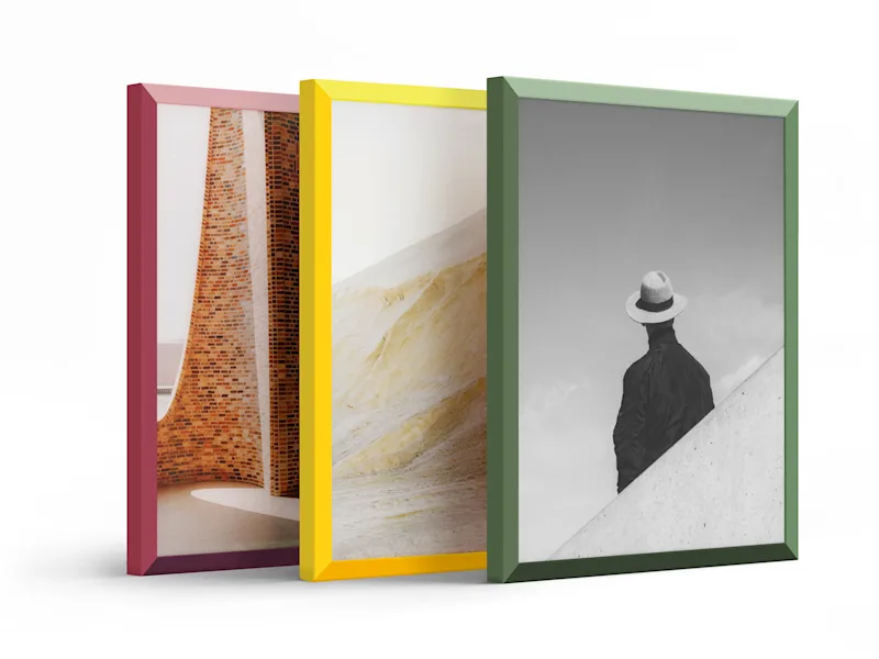 Frame: WhiteWall Design Edition by Studio Besau-Marguerre Three design edition frames, one of each color, standing next to each other.