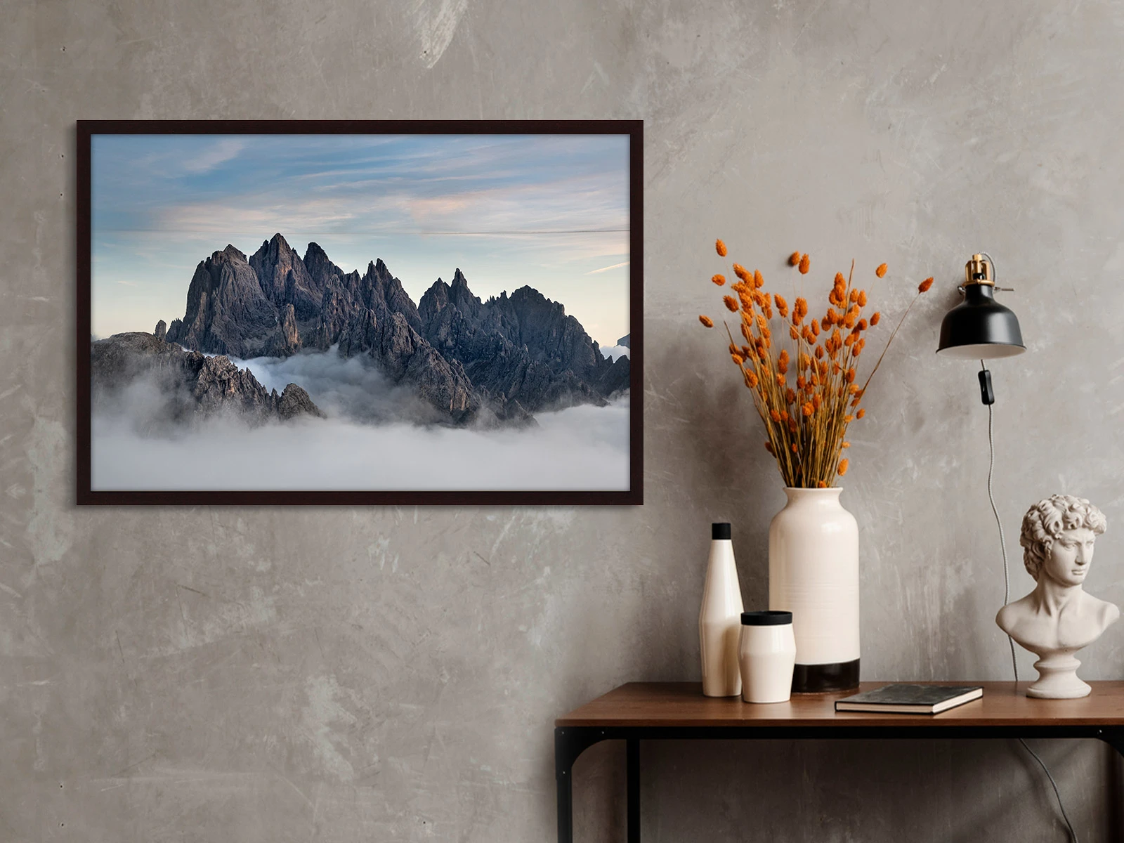 Overcast cloud in a mountain range in a Gallery Frame on a wall in a living room.