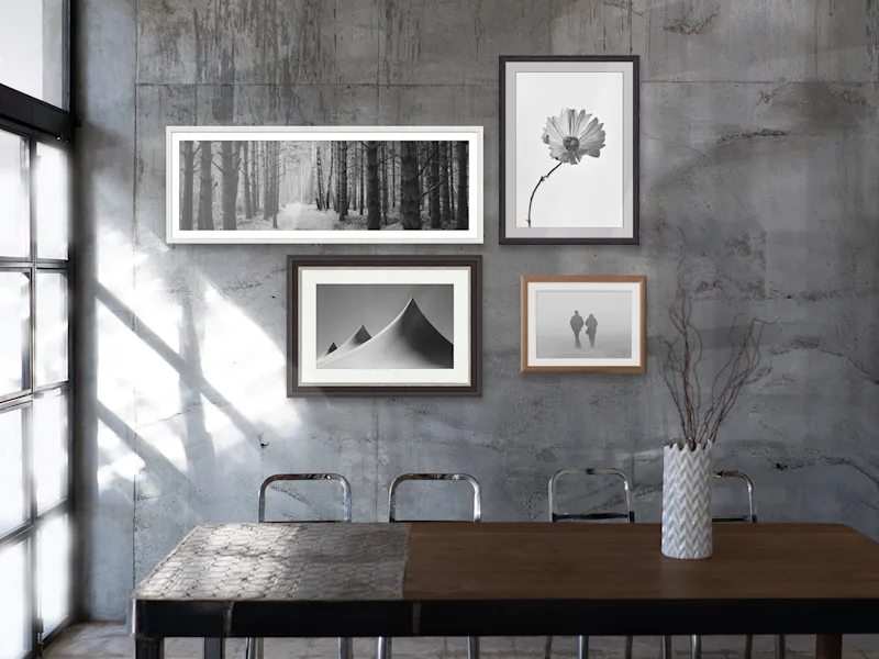 Photo Print On Ilford B/W Paper Several black-and-white Ilford photo prints in frames hanging on a wall.