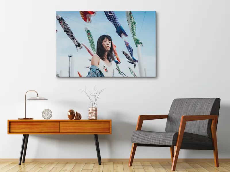 Matte Canvas On Stretcher Frame 3 Woman standing in front of lanterns as a matte canvas print on a stretcher frame hanging on a wall.