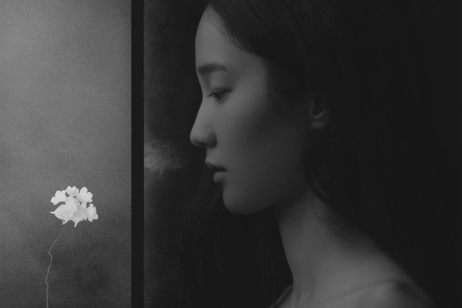 portrait of a woman with a flower - photo by Suxing Zhang.