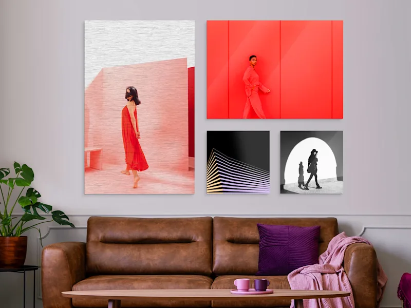 ChromaLuxe HD Metal Print 4 Several different motifs on an HD Metal Print hang on a wall in a living room.