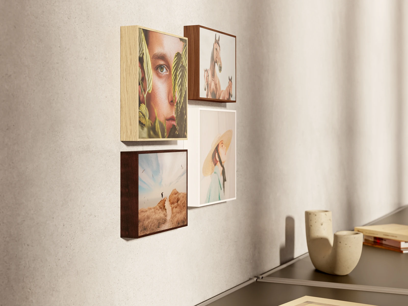 Hanging arrangement of four ArtBoxes above a sideboard.