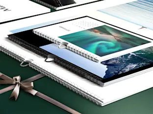 Photo Calendar whitewall photo calendars in different formats lying on a table.