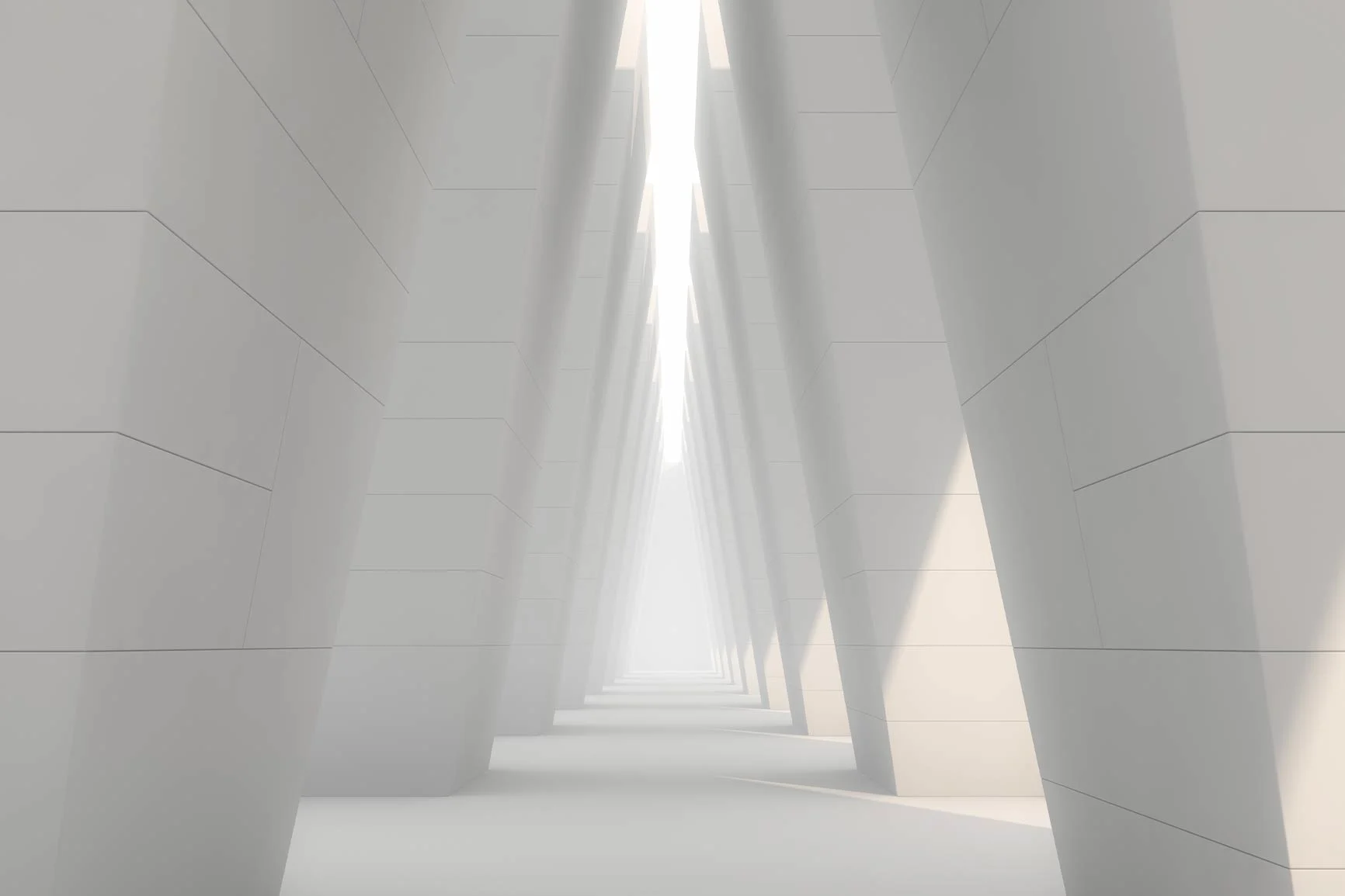 Bright, minimalist hallway A view down a bright, minimalist hallway with large, slanted columns on both sides.