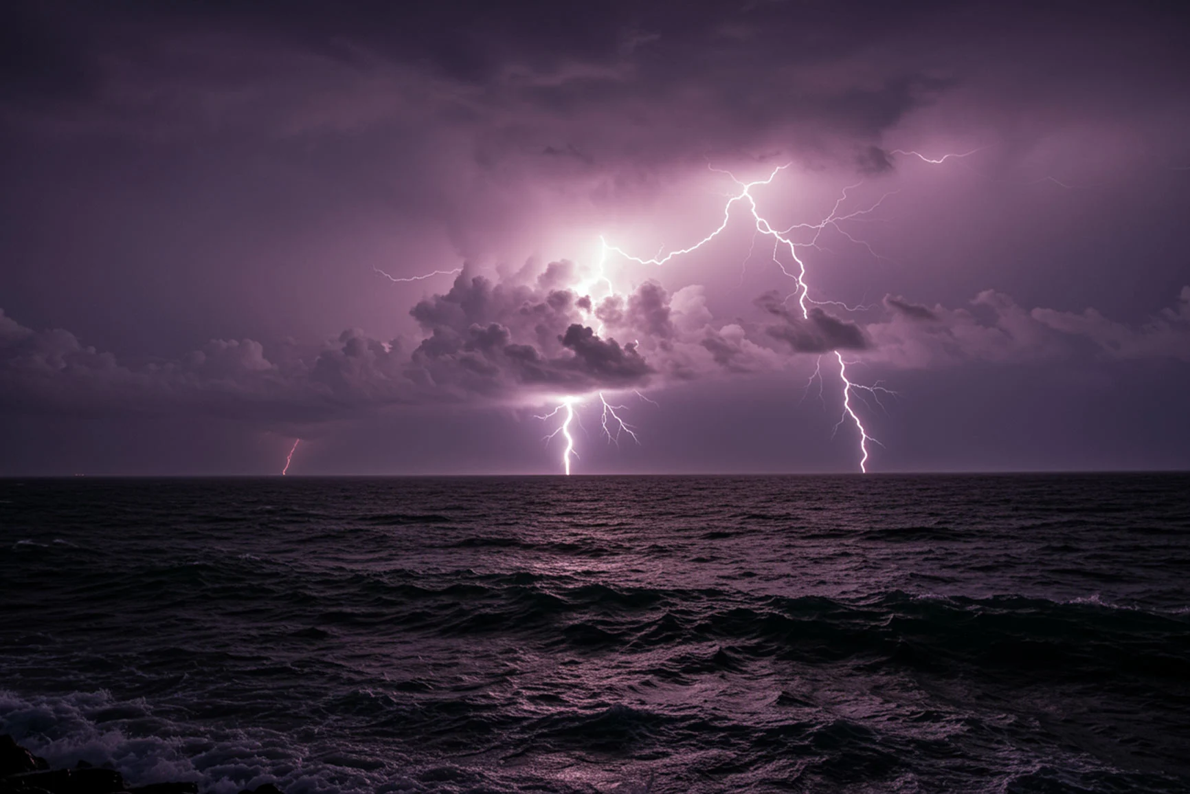 Lightning over the sea Lightning strikes over the sea under a cloudy sky.