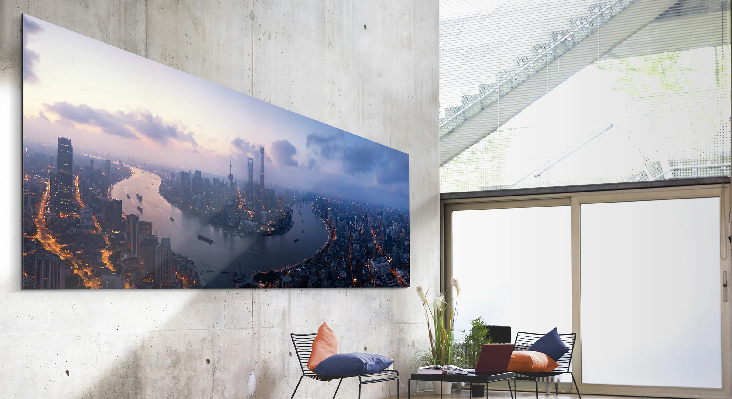 Skyline panorama photo as WhiteWall Masterprint hanging on a lounge wall.