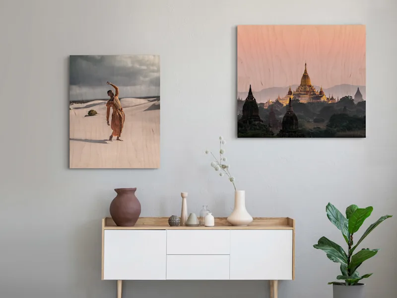 Direct Print On Wood Two motifs on direct print on wood on a wall in a living room. One with a person stands in front of sand dunes and one with a temple.