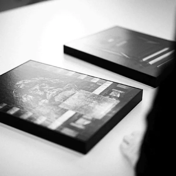 Ruediger Glatz in Frechen visiting the WhiteWall Photo Lab Black and White photograph of two black and white prints with a frame. The prints are black and white and displaying details of the german city Chemnitz. The photographs have been taken by Ruediger Glatz and are part of his series Kamenica.