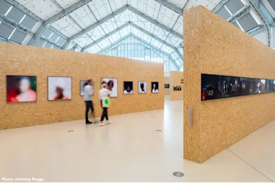 8th Triennial of Photography Hamburg Exhibition hall with gallery walls at the Phototriennale in Hamburg.