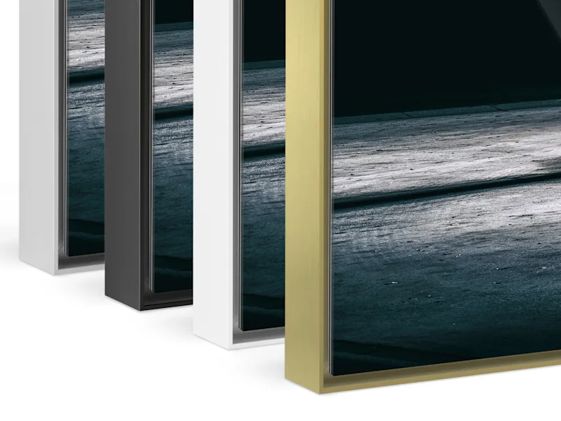Aluminum ArtBox 1 Close up of our ArtBox Aluminum frames in the colors silver, black, white and gold standing behind each other.