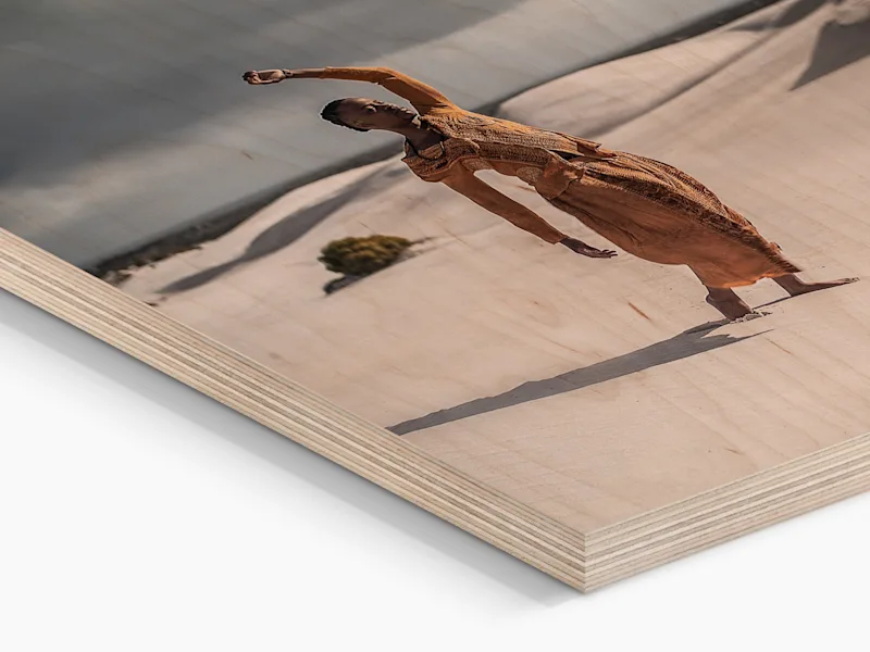 Direct Print On Wood Close-up of a person standing in front of sand dunes in a desert, printed directly onto wood.