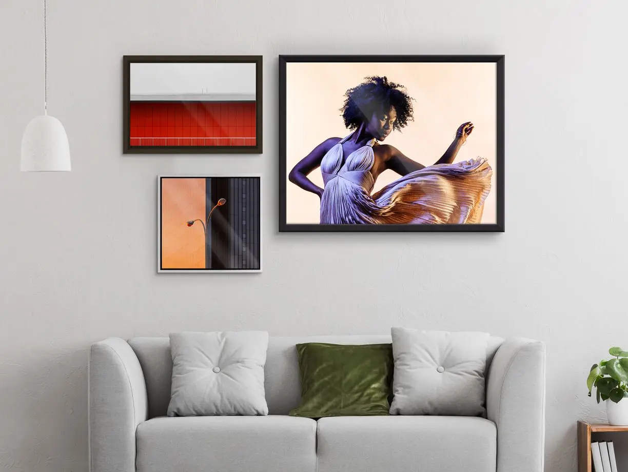 Several different motifs on an HD Metal Print with different frames hang on a wall in a living room.
