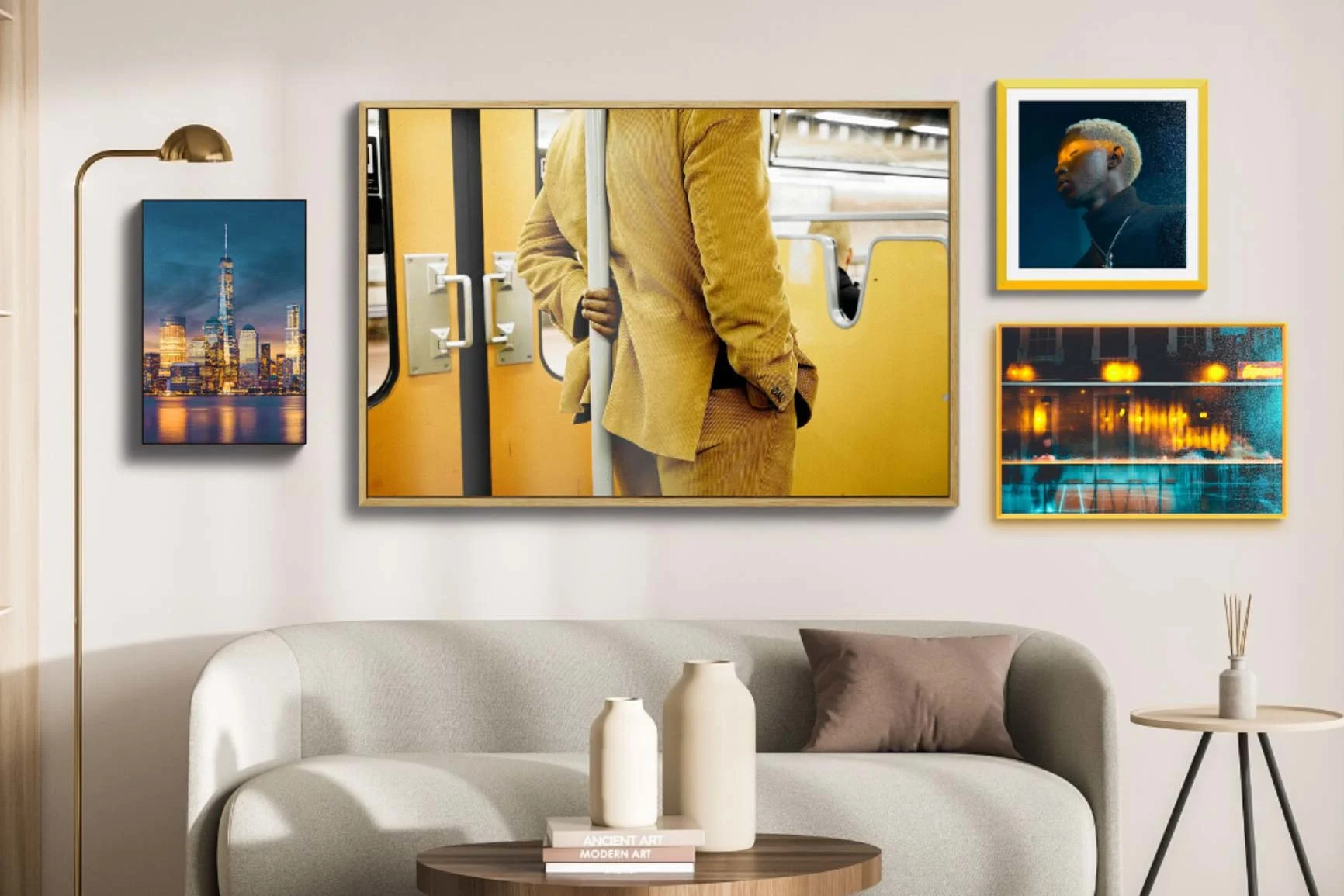Living room with four framed pictures A living room with four framed pictures on the wall, including a close-up of a man in a yellow coat on the subway.
