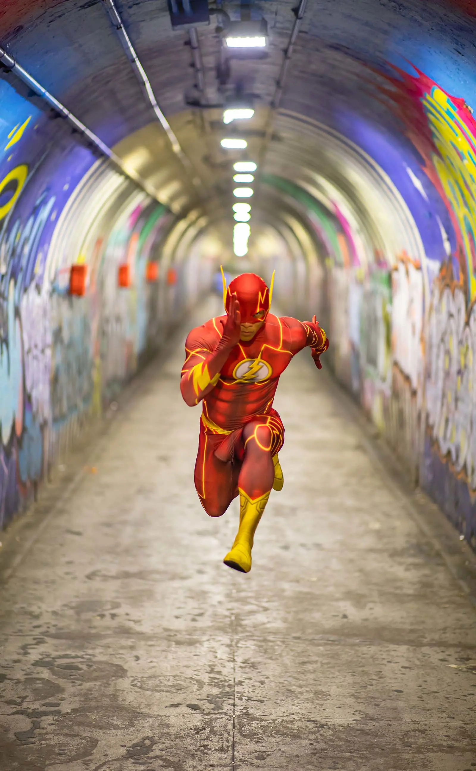 man dressed as flash running.