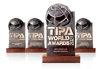 WhiteWall – TIPA Award 2021 Four TIPA World Award trophies from 2013, 2017, 2020 and 2021 on wooden bases.