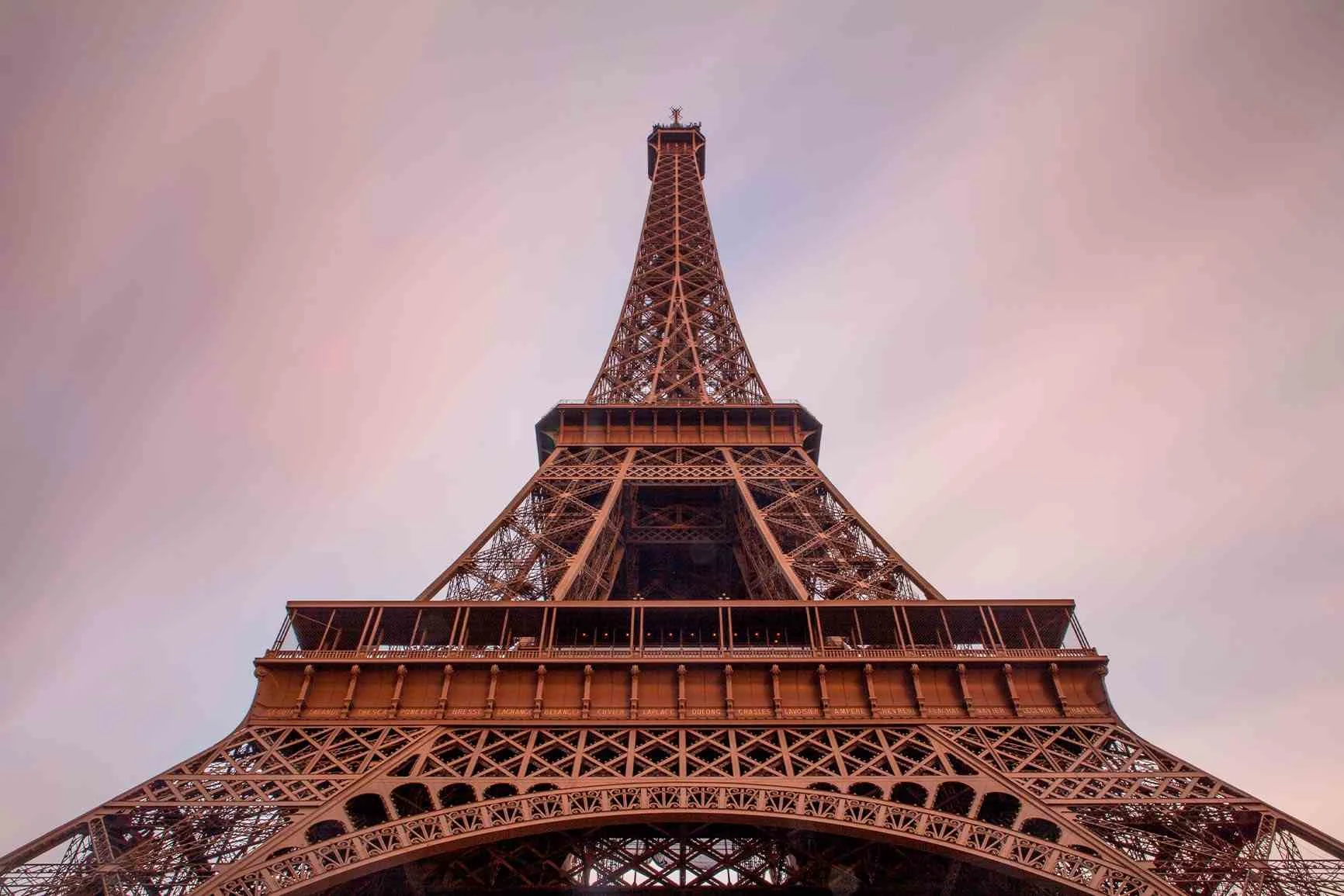 The Eiffel Tower from below A close-up of the Eiffel Tower from below against a cloudy sky.