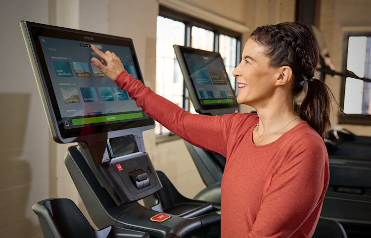 Precor Facility_P94 700 TRM Console Close Up with Person Engaging with Media.png