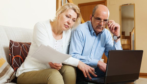 Couple looking at their will online