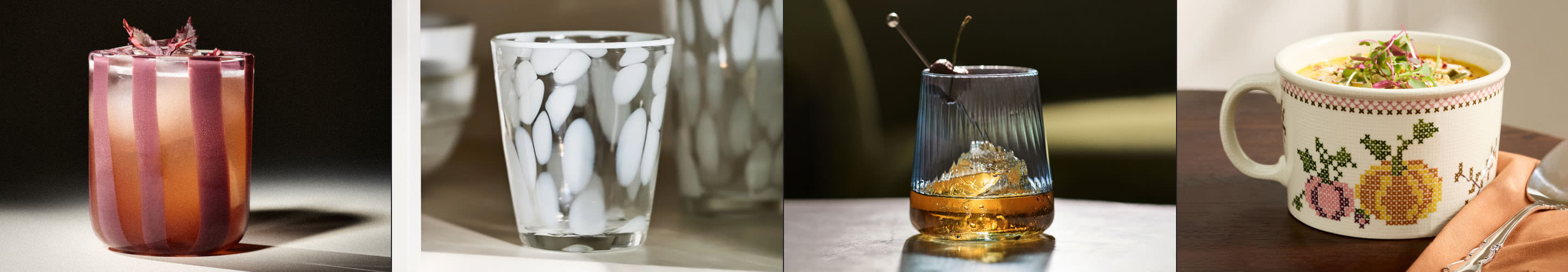 Four beverages in different glassware: pink ombre cocktail, white drink with ice, whiskey with ice sphere, and soup in decorative mug.