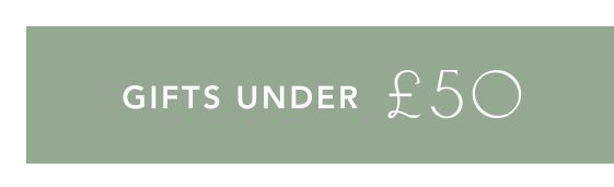 Purple banner with white text reading GIFTS UNDER Β£50 in modern sans-serif font against a solid background.