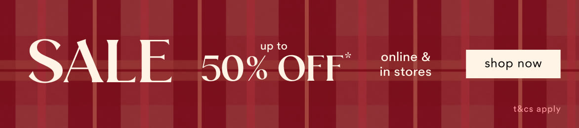 Red plaid banner reading SALE up to 50% OFF online and in stores with shop now button on right side