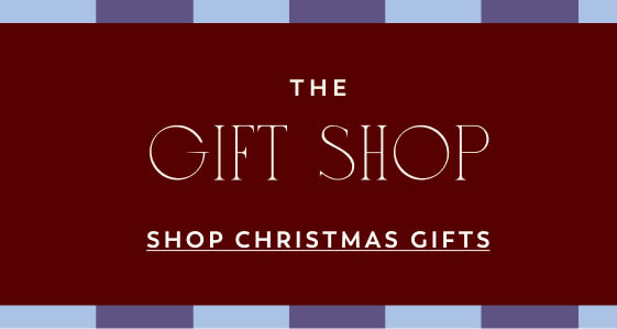 THE GIFT SHOP - SHOP CHRISTMAS GIFTS text on dark red background with blue and purple striped border at top and bottom