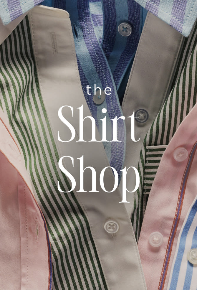 Close-up of colorful striped shirts with text overlay reading "the Shirt Shop" in white serif font