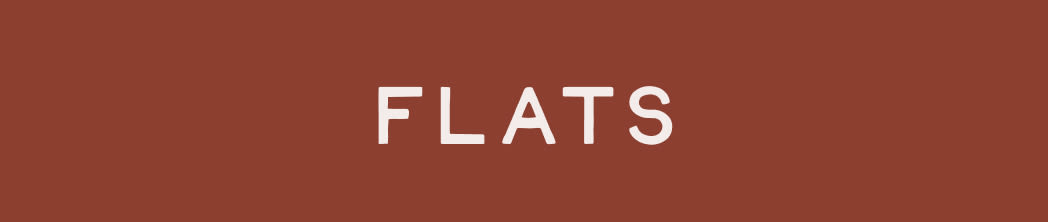 White text reading FLATS on a rust-colored background