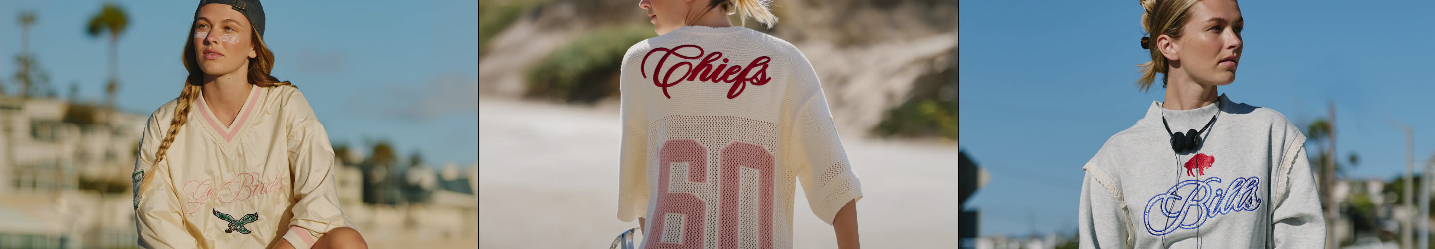 Three women modeling sports jerseys outdoors: left in cream Chiefs jersey, center in white Chiefs 80 jersey, right in gray Bills jersey.