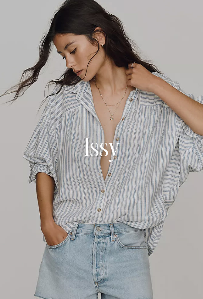 Woman in blue and white striped button-up shirt and light denim jeans with text "ISSY" overlaid on the image.