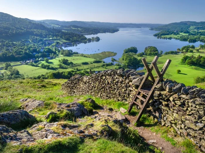 A morning shot of Lake Windermere showing the stone walling and the stile providing passage over the wall.