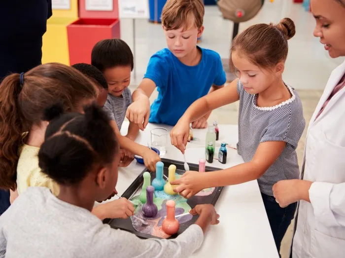 School kids taking part in experiment at science centre