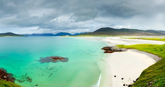 Panoramic view of Luskentyre white beaches under dramatic sky, Isle of Harris, Scotland