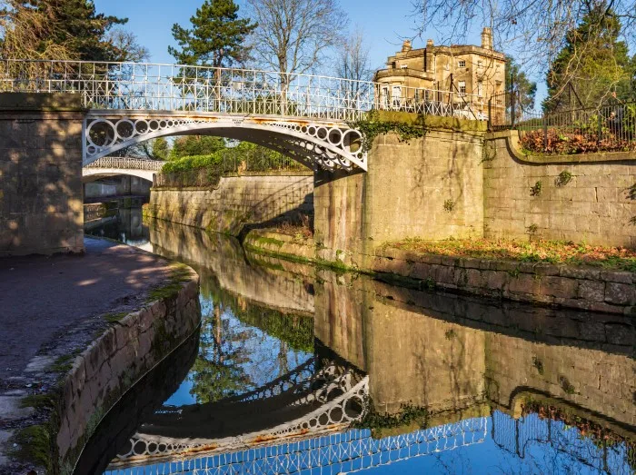 Grade II listed decorative iron footbridges over the Kennet and Avon Canal at Sydney Gardens in Bath