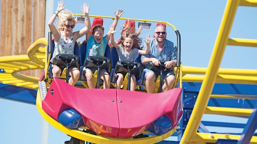 Family riding the Twister ride at Crealy Theme Park & Resort in Devon