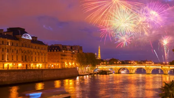 Pont Neuf and Cite island over Seine river with Paris cityscape and fireworks at night, France