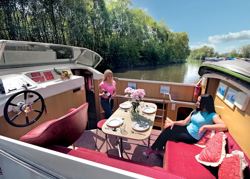 Girls boat trip with Richardson's Cruisers (RICB) on the Norfolk Broads, Norfolk, England, UK