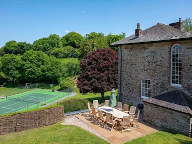 Tennis court on the grounds of Moorleaze Farm holiday cottages in Frome, Somerset, England, UK
