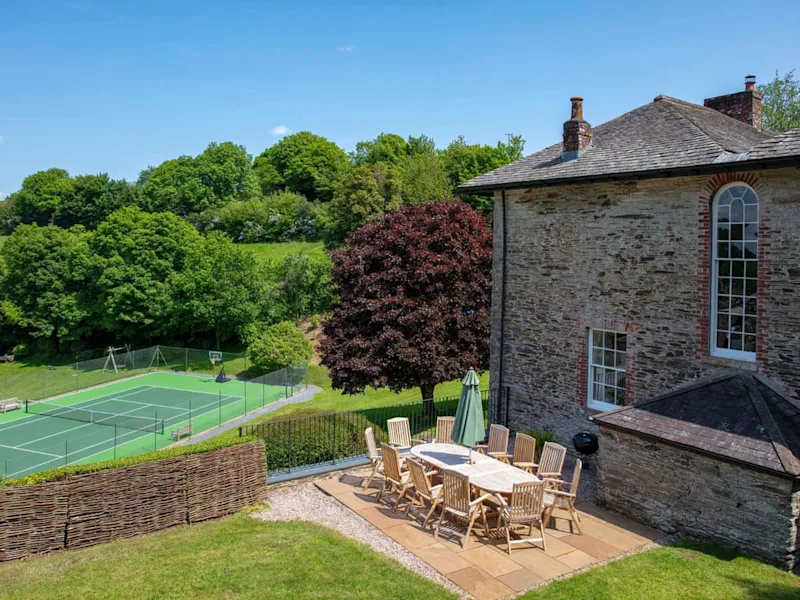 Tennis court on the grounds of Moorleaze Farm holiday cottages in Frome, Somerset, England, UK