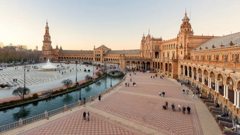 scenic view of Plaza de España The Plaza de España is a plaza in the Parque de María Luisa, Historical landmark in Seville sunset,
