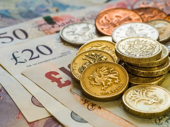 British coins stack on black, pound sterling