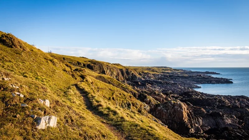 A rugged coastal trail along the solway firth on a sunny winters day,