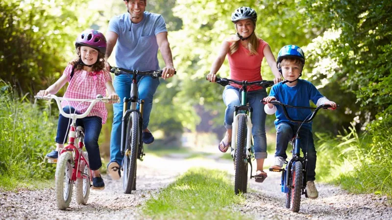 Family On Cycle Ride In Countryside