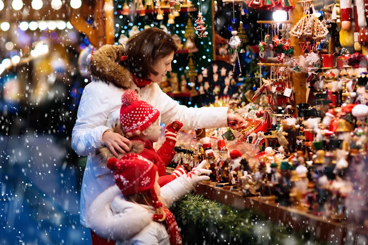 Family browsing Christmas market stalls