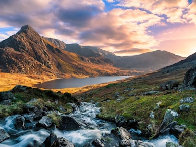 A rushing river flowing through the mountains of wales