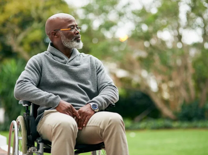 Taking in the views. Cropped shot of a handsome senior man sitting in his wheelchair outside.